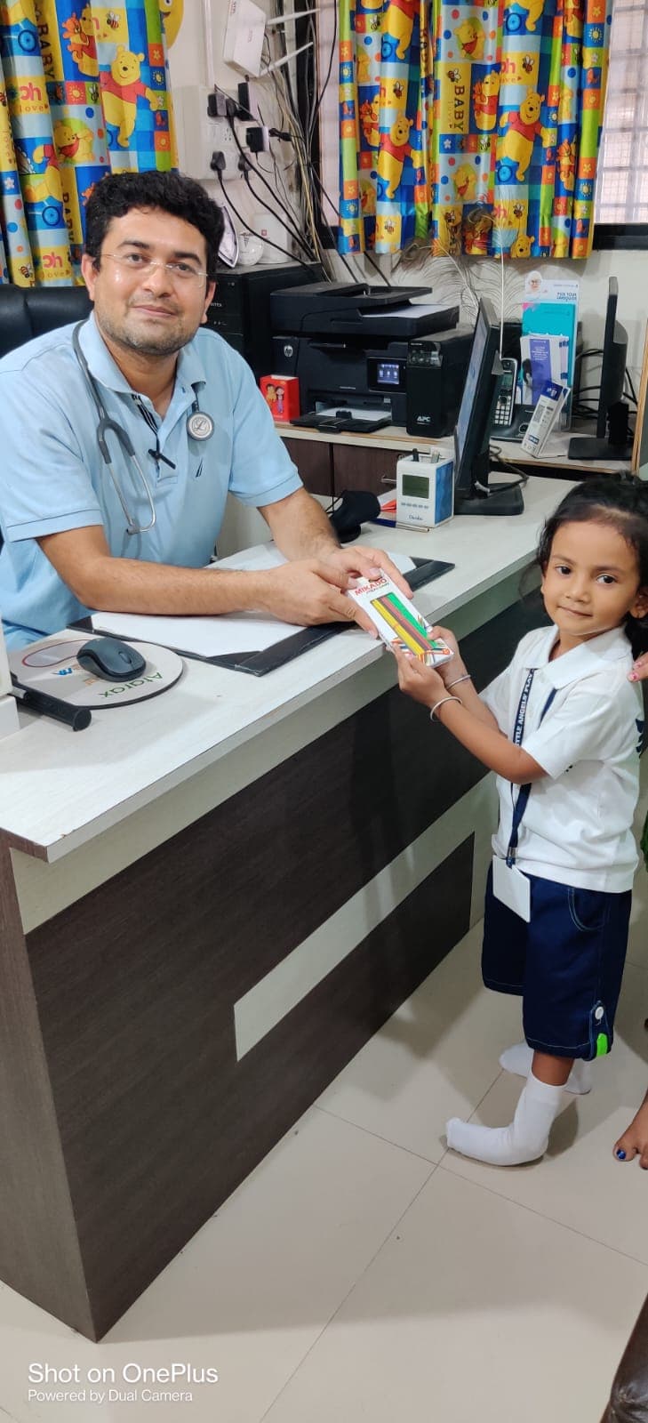 Dr. Tarun Parikh interacting with a young patient
