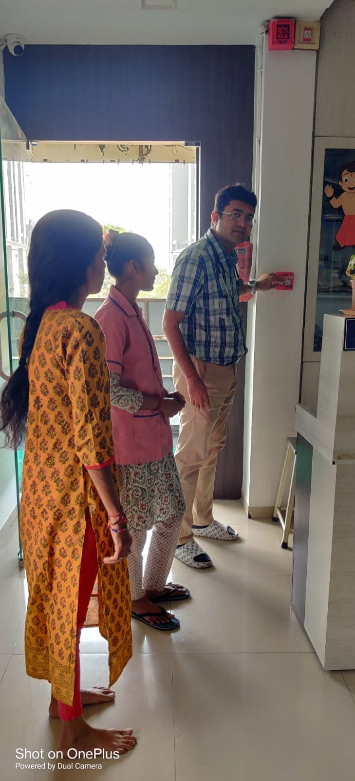 Demonstrating fire alarm operation to staff